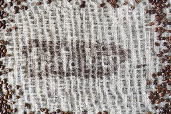 Burlap texture with coffee beans border — Stock Photo, Image
