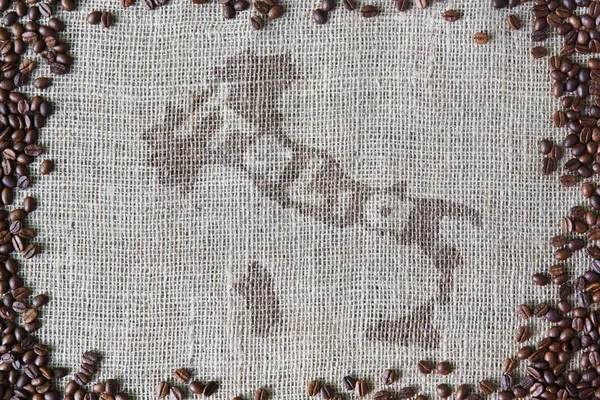 Texture di iuta con bordo chicchi di caffè — Foto Stock