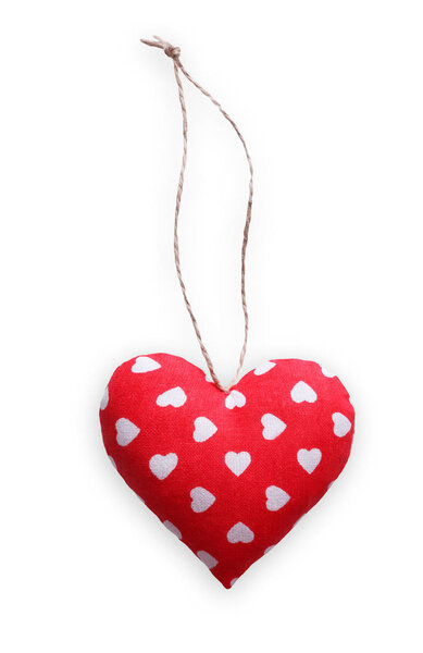 Red spotted sewed pillow heart isolated on white background, valentine