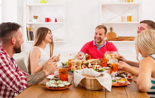 Group of happy people at festive table dinner party — Stock Photo, Image