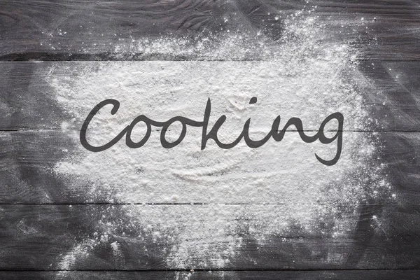 Baking concept on wood background, sprinkled flour with copy space — Stock Photo, Image