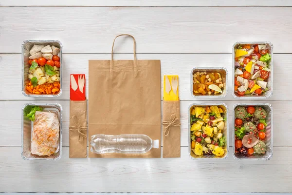 Healthy food take away in boxes, top view at wood — Stock Photo, Image