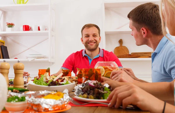 Group of happy people at festive table dinner party — Stock Photo, Image