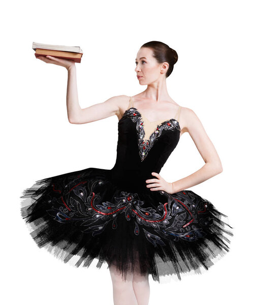 Балерина с книгой на белом фоне
