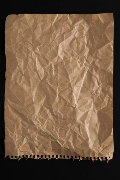 孤立在黑色背景上的旧纸页 — 图库照片