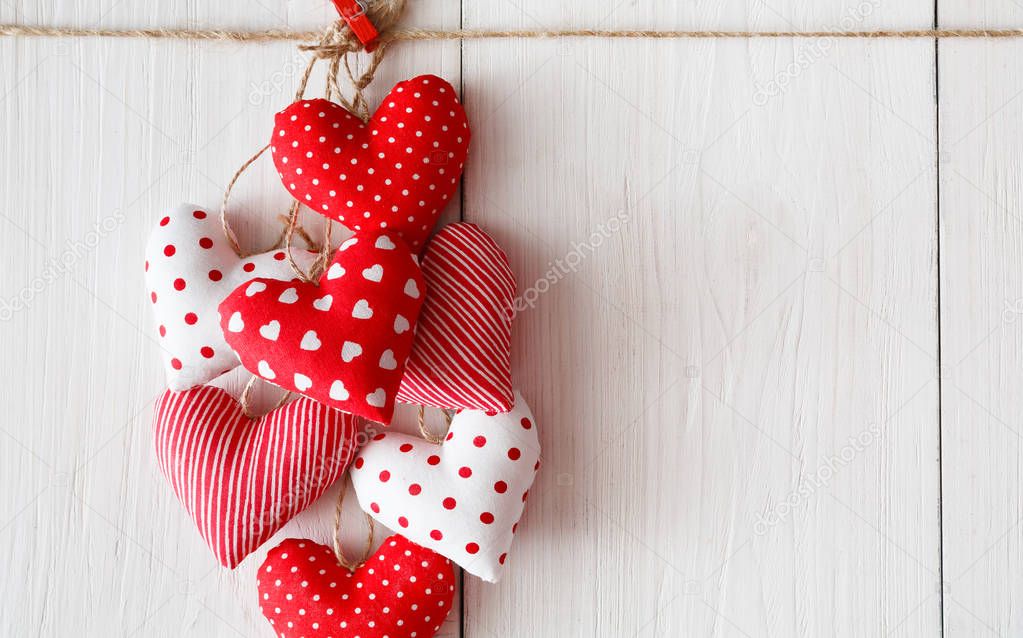 Valentine day background, pillow hearts bunch on wood, copy space