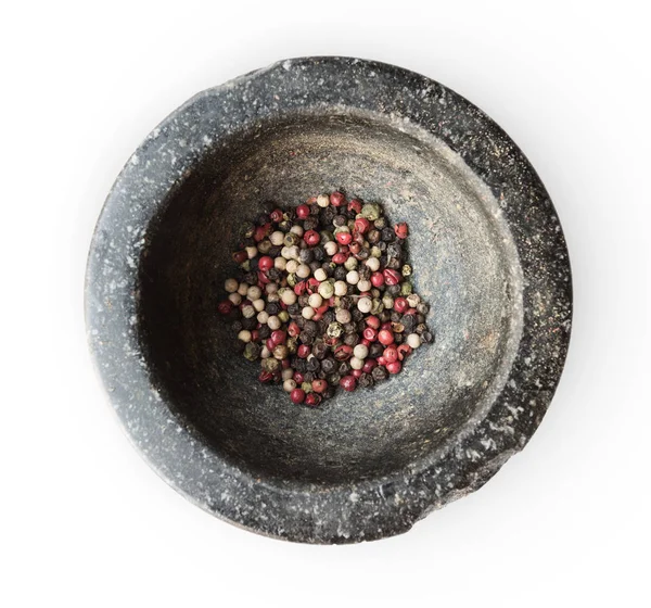 Closeup mix papriky v kamenné malty, pohled shora, izolované — Stock fotografie