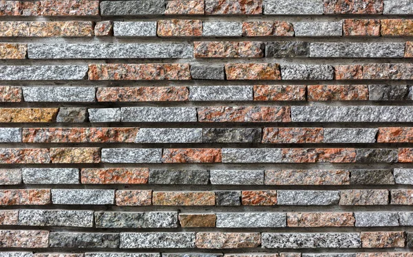 近代的な装飾的な色石レンガの壁の背景 — ストック写真