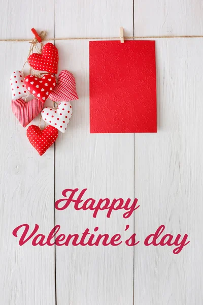Valentine day background, pillow hearts and card on wood — Stock Photo, Image