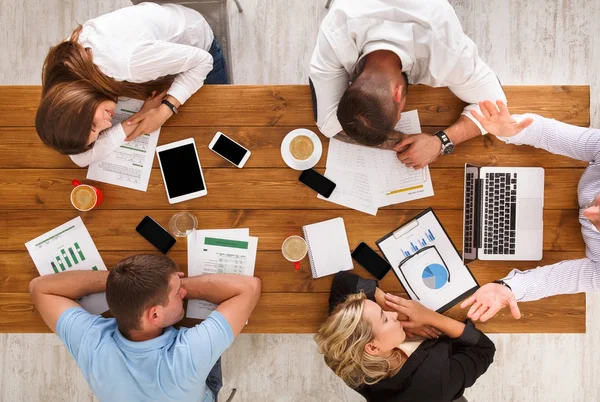 Group of business people exhausted sleep in office, top view
