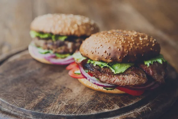 Classic american burgers, fast food on wood background — Stock Photo, Image