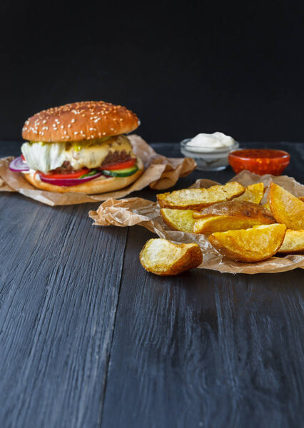 Fast food restaurant dish. Hamburger and fries wedges