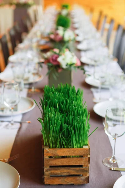 Served wedding table with grass decorations — Stock Photo, Image