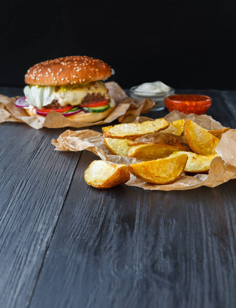 Fast food restaurant dish. Hamburger and fries wedges