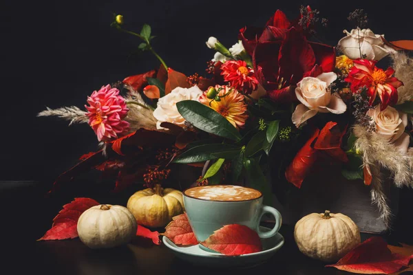 Cappuccino coffee and flowers composition on black background — Stock Photo, Image