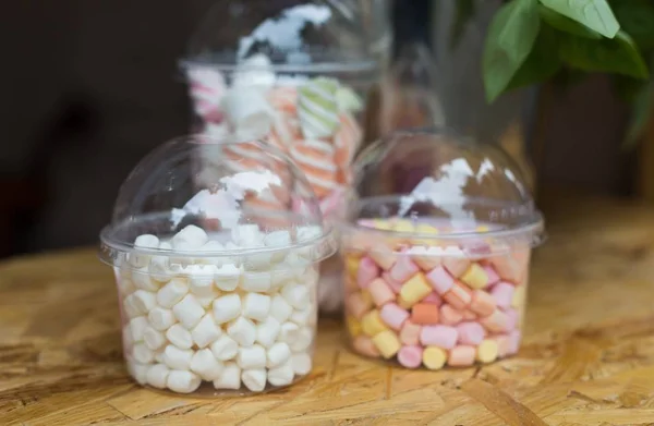 Marshmallows in glass jars on bar for sale — Stock Photo, Image