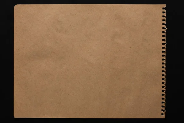 Brown paper sheet isolated on black background — Stock Photo, Image