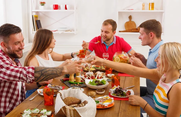 People say cheers clink glasses at festive table dinner party — Stock Photo, Image