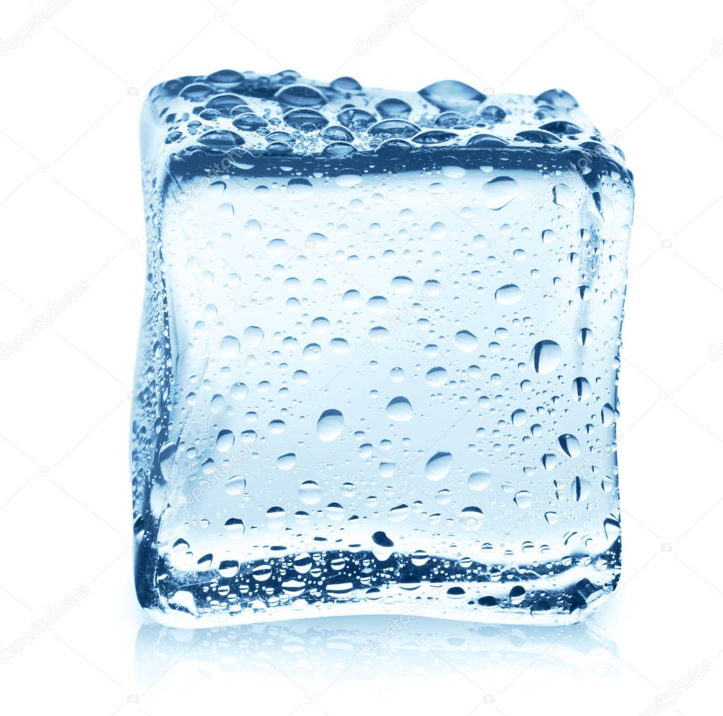 Transparent ice cube with reflection on blue glass with water drops