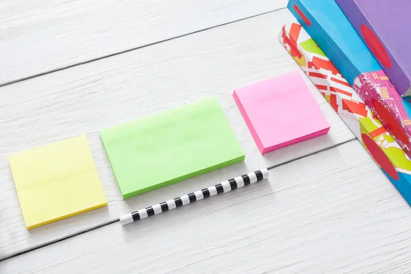 Flat lay of stationery supplies on white wood — Stock Photo, Image