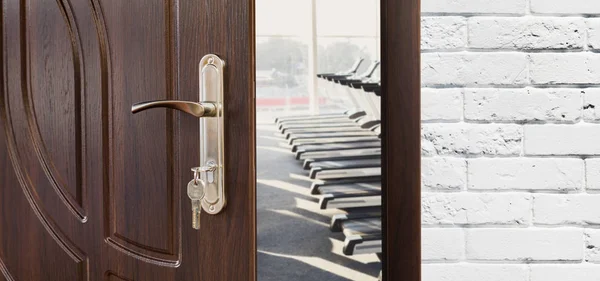 Entrance to gym in fitness club, opened door with treadmills — Stock Photo, Image