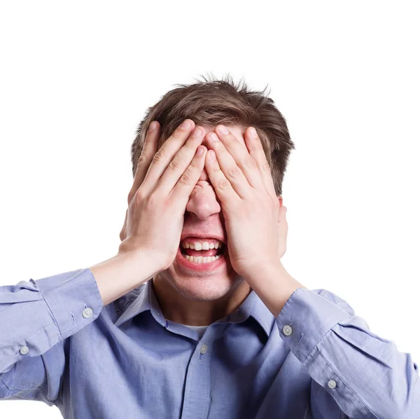 Angry man covering eyes with palms and shouting Royalty Free Stock Photos