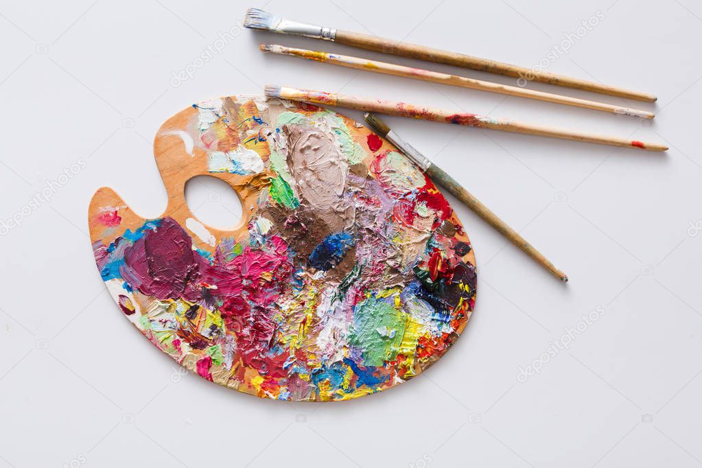 Art palette with colorful paint strokes, isolated