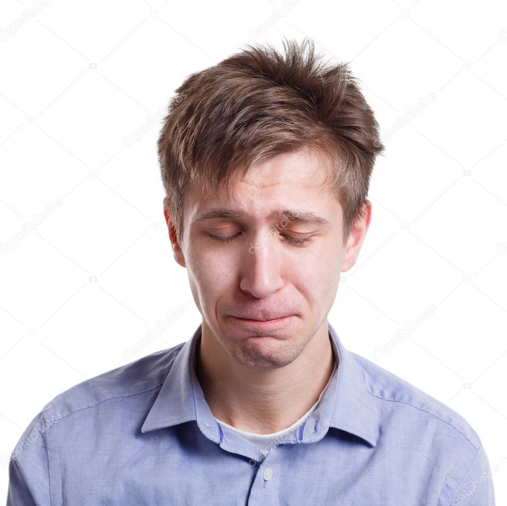 Sad man face expressing negative emotion, isolated