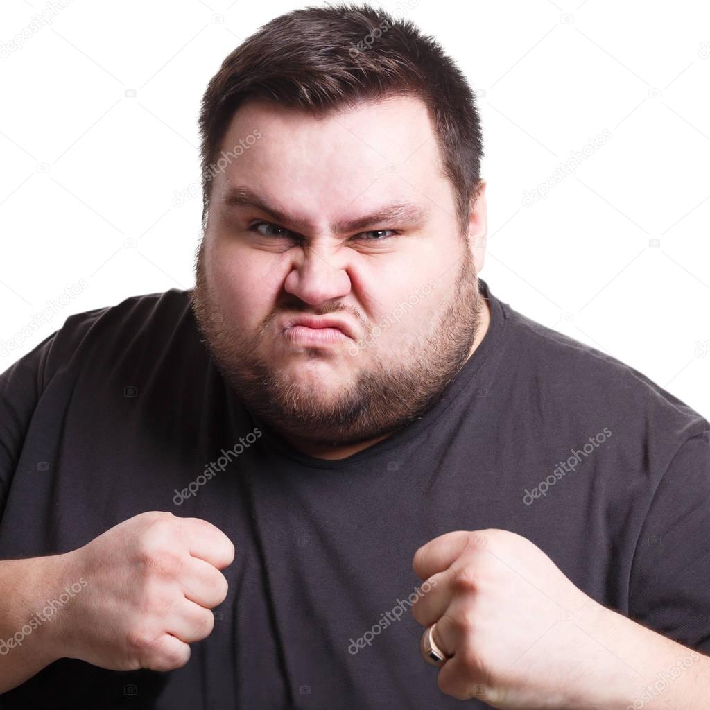 Angry man fighting with clenched fists, isolated