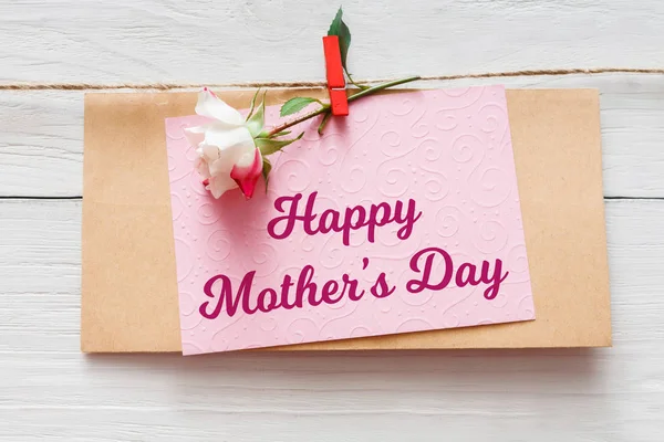 Mothers day background, card and rose flower on white wood — Stock Photo, Image