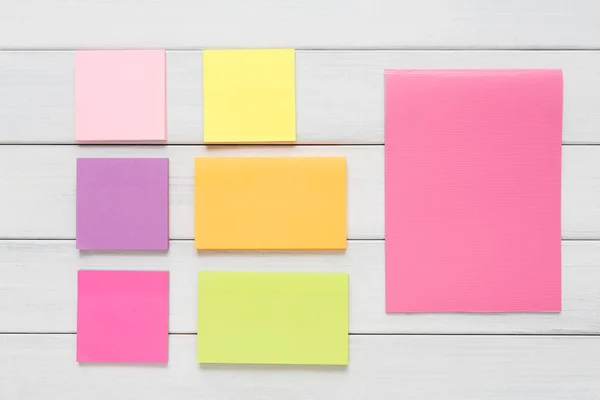 Stationery supply - sticky notes paper on wood — Stock Photo, Image