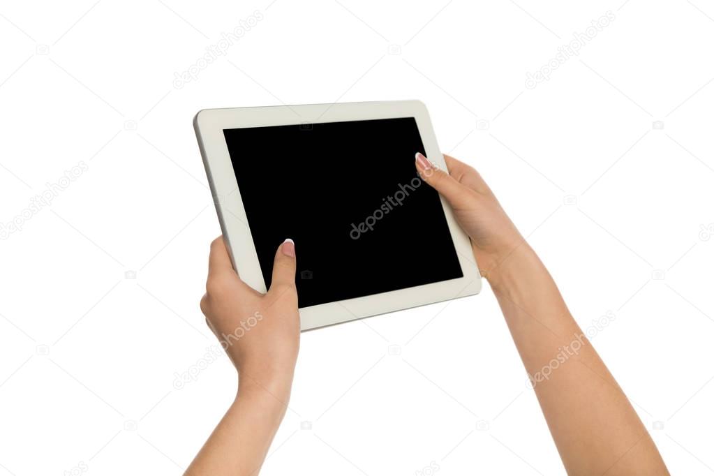 Woman holding digital tablet with blank screen
