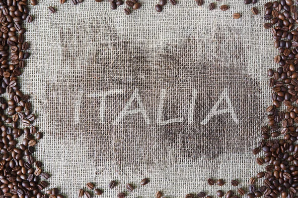Säckväv textur med kaffebönor gränsen — Stockfoto