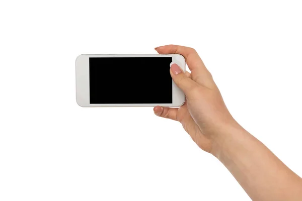 Manos femeninas apuntando a la pantalla del teléfono móvil en blanco —  Fotos de Stock