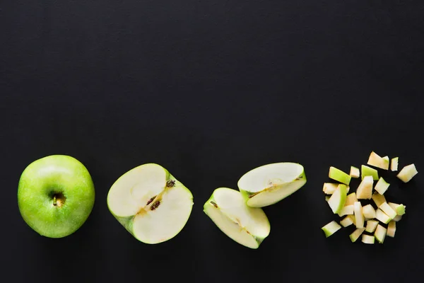 Stages of cutting tomato on black background