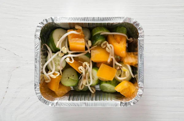 Healthy food in foil boxes, diet concept. Soy sprouts salad — Stock Photo, Image