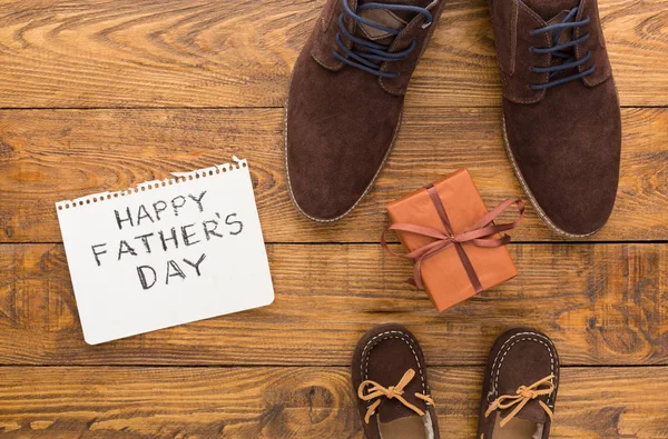 Happy Fathers Day card on rustic wood background