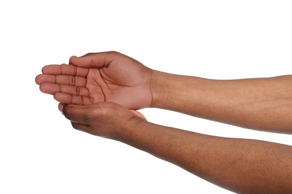 Zwarte mannelijke handen houden in holle vorm, knipsel — Stockfoto