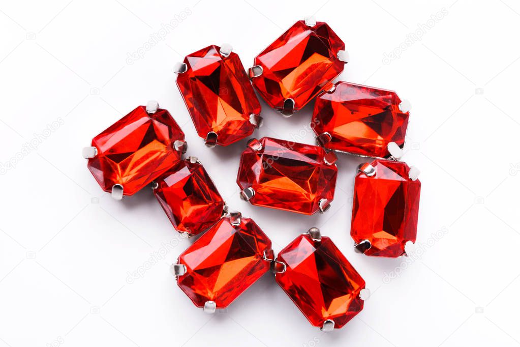 Ruby loose gemstones pile on white background