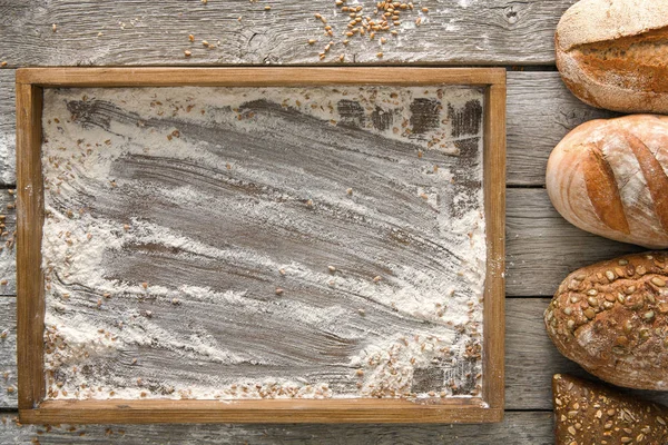 Bread bakery background. Brown and white wheat grain loaves comp