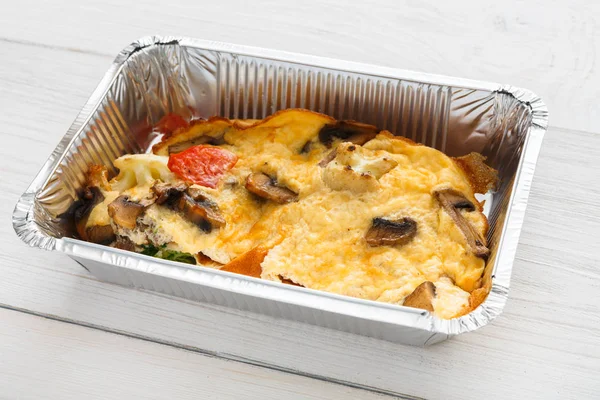 Healthy food take away in foil box — Stock Photo, Image