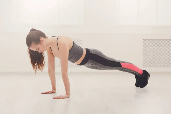Fitness woman plank training indoors — Stock Photo, Image
