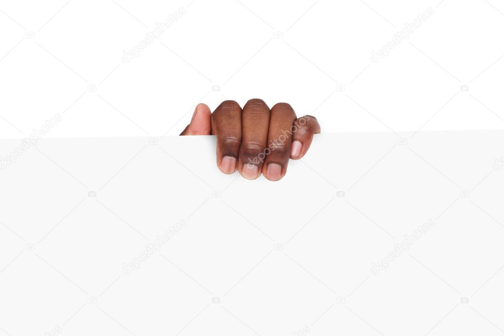 Black hand holding blank advertising card