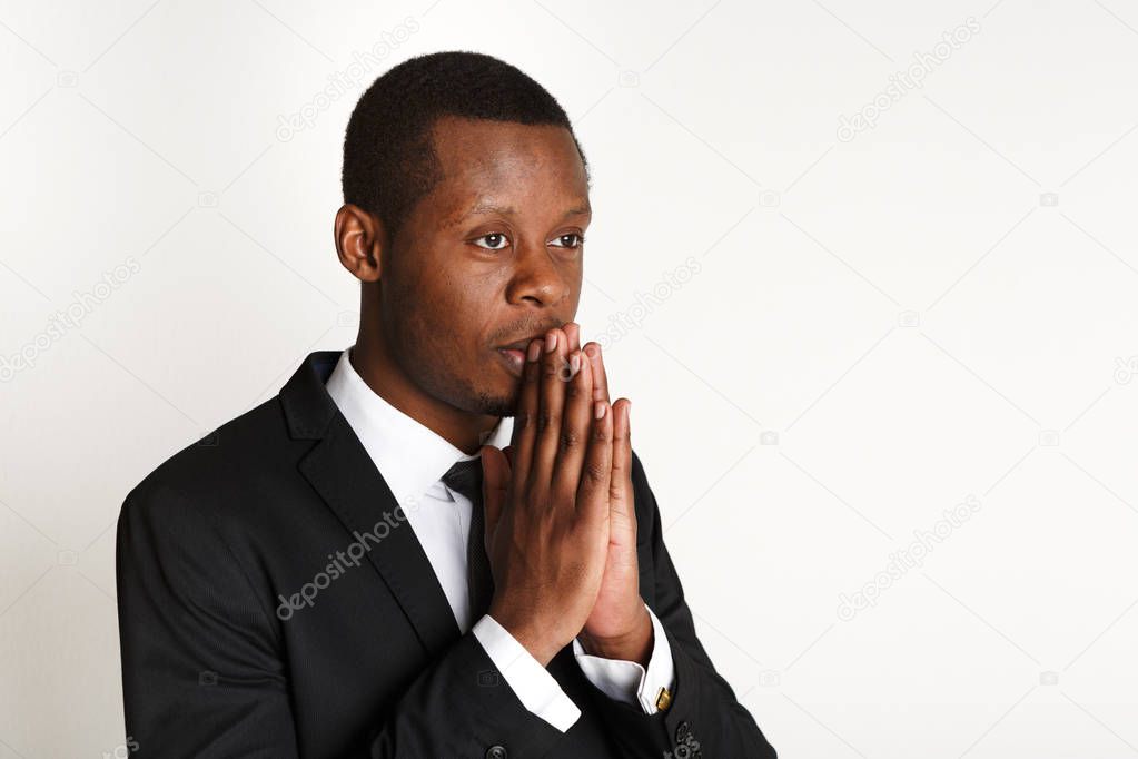 African american business man praying copy space