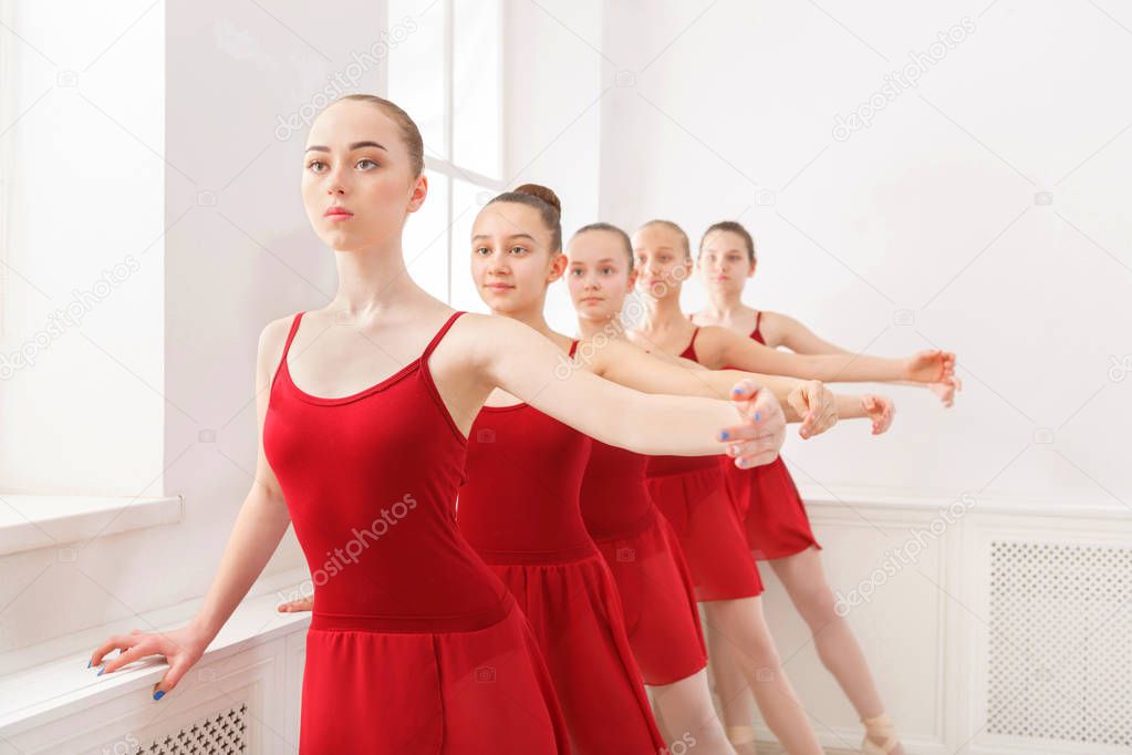 Young girls dancing ballet in studio
