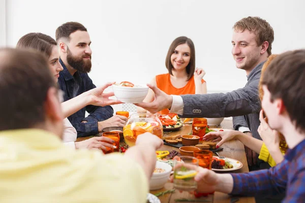 Group of happy people at festive table dinner party — Stock Photo, Image