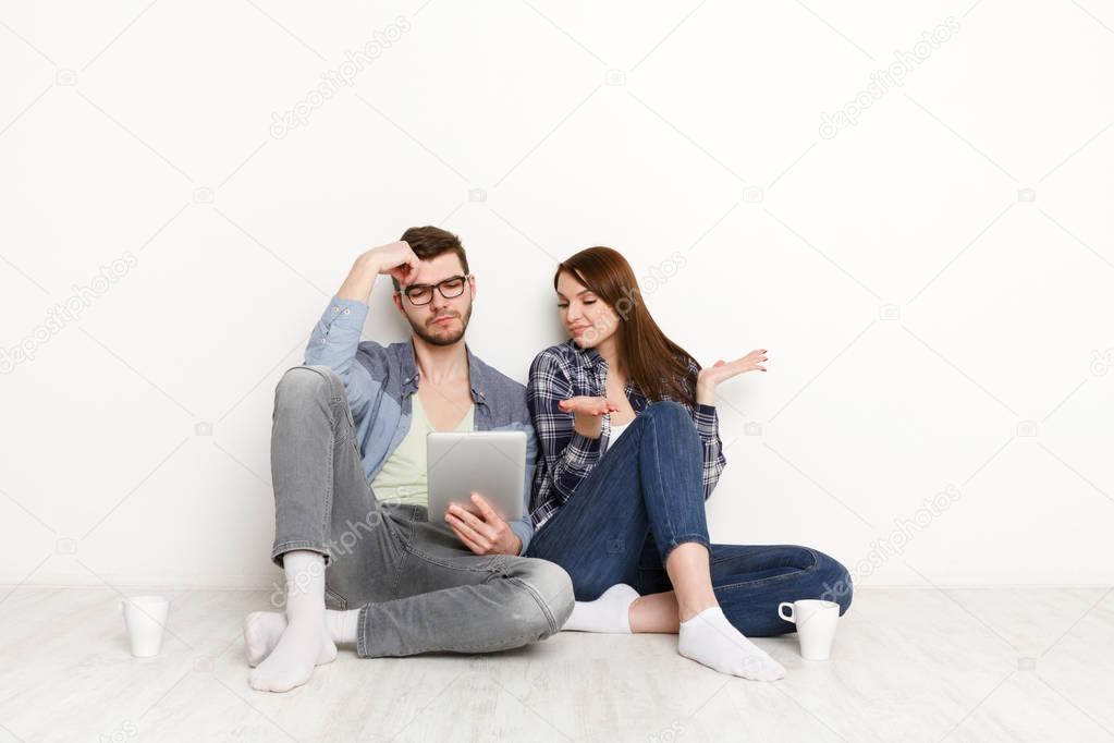 Couple shopping online on digital tablet