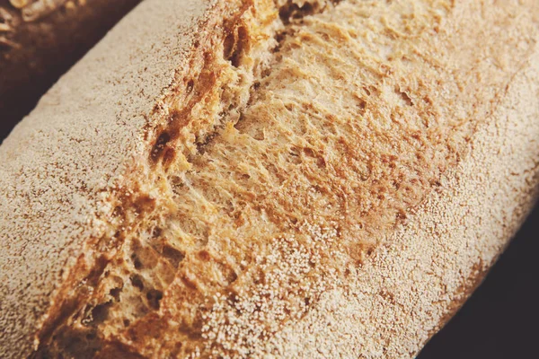 Bread texture background, closeup of baguette loaf