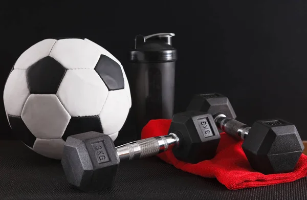 Sport equipment on black background, copy space
