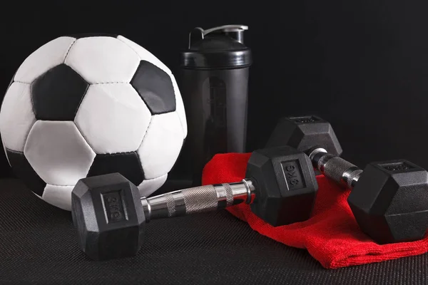 Sport equipment on black background, closeup